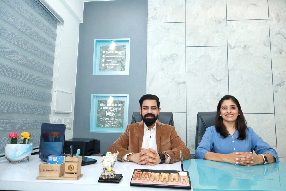 Dr. Gagan Jaiswal and Dr. Shardha Jaiswal, seated at a desk in our Dental clinic Vijay Nagar Indore