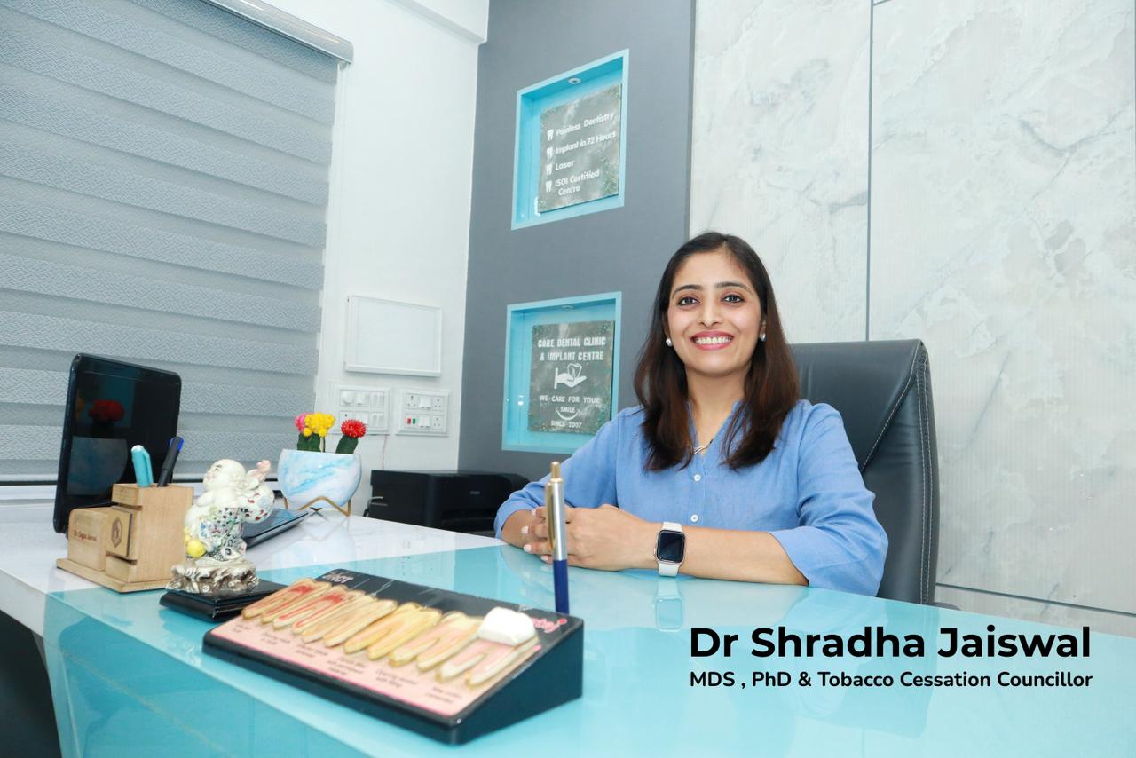 Meet Dr. Shardha Jaiswal MDS, PhD & Tobacco Cessation Councillor is seated at a desk in our Dental clinic Indore