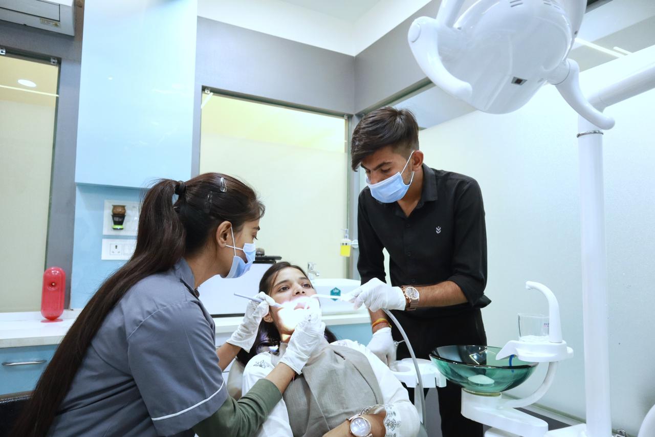 Care Dental Clinic team attends to a patient in a dental chair in Vijay Nagar Indore.